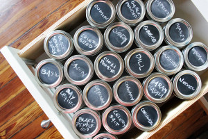 Photo of labeled spice jars in a drawer.