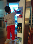 The son raiding the refrigerator. Credit: Grace G Lau