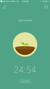 An in-app screen, encouraging the user to "Stay focused!" with a countdown timer and image of a growing sapling.